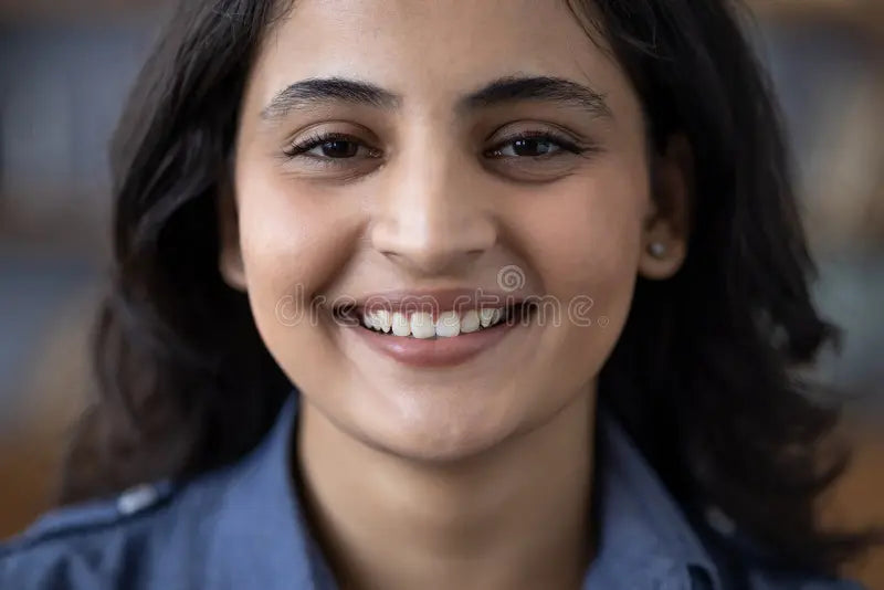 files/close-up-portrait-happy-young-brunette-indian-woman-denim-shirt-smiling-camera-359227126.webp