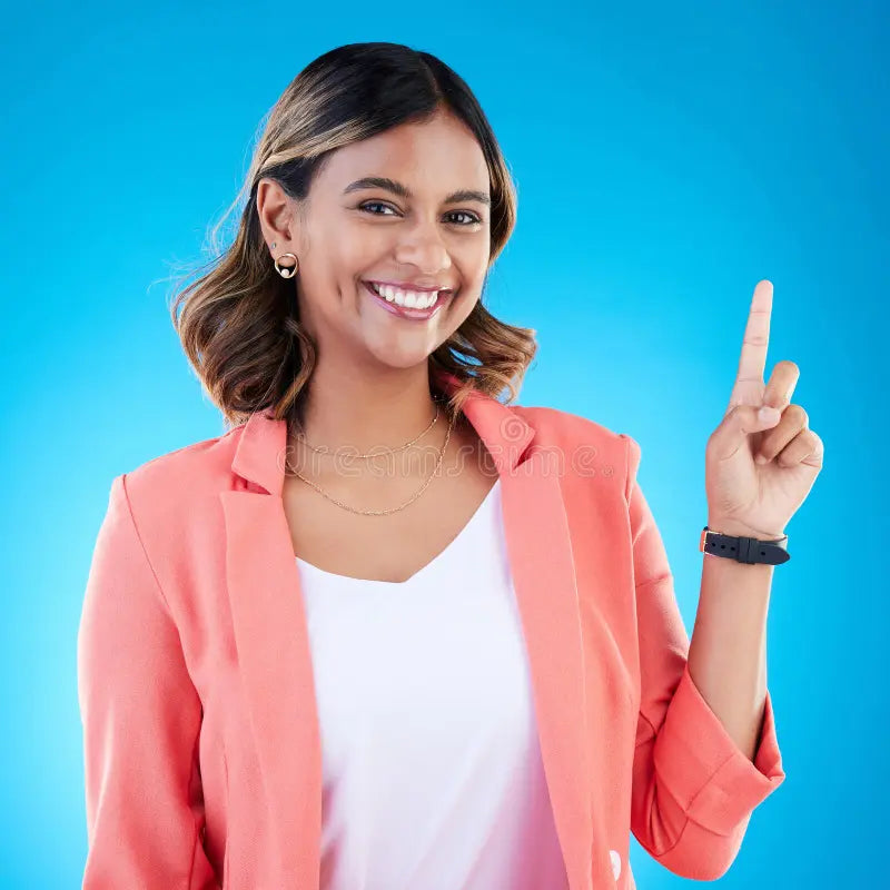 files/smile-portrait-indian-woman-studio-pointing-up-product-placement-mockup-information-deal-promotion-announcement-272177385.webp